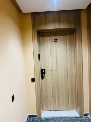a wooden door with the number on it at Monolocale l'alba Hevernage 1ch in Marrakech