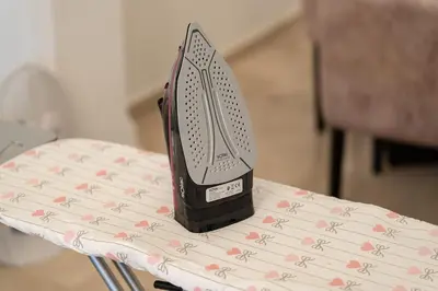 a iron sitting on top of a table at Urban Pearl terrace and pool in Marrakech