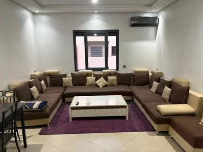 a living room with a couch and a coffee table at cozy and warm apartment in Marrakech