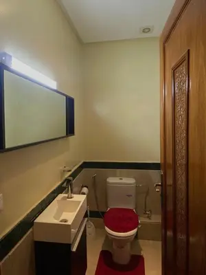 a bathroom with a toilet and a sink at Modern 2-Bedroom Apartment in Gueliz in Marrakech