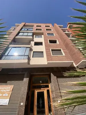 a tall building with a door in front of it at Modern 2-Bedroom Apartment in Gueliz in Marrakech
