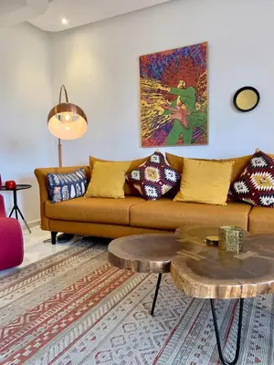a living room with a couch and a coffee table at Top Floor Apartment with terrace and pool in Marrakech