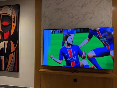 a flat screen tv with a soccer game on it at Cosy Studio Cinema PS5 and home cinema 10 min Downtown in Marrakech