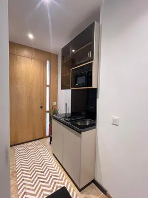 a kitchen with a counter top and a microwave at studio à marrakech in Marrakech