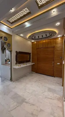 a large room with a garage with a wooden door at Villa Targa Marrakech in Marrakech