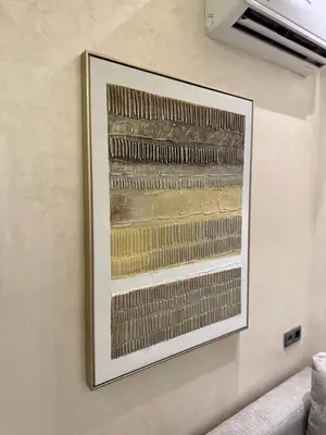 a picture on a wall with a painting on it at Yumo - Cozy 3 in Marrakech