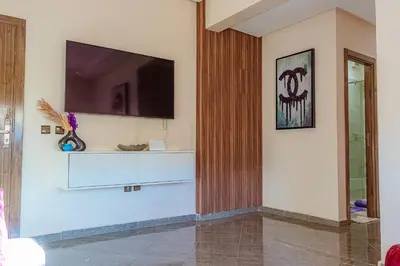 a living room with a tv on a wall at 2 bedrooms abouab gueliz in Marrakech