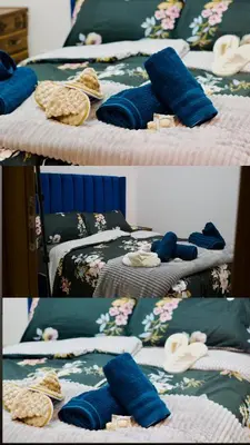 two pictures of two beds with blue pillows on them at Khamo Apartment, 15 min Walking to Airport, 15 min by Taxi to Medina in Marrakech