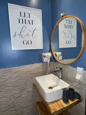 a bathroom with a white sink and a mirror at Elegant apartment in Guéliz in Marrakech