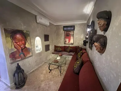 a living room with a couch and a table at Your Soul's Retreat-Entire Riad in Marrakech