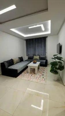 a living room with a couch and a table at Charming Marrakech Duplex in Marrakech