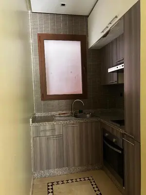 a small kitchen with a sink and a window at Vizir Center Apartment Marrakech A103 in Marrakech