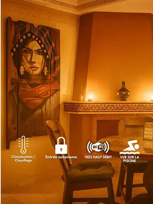 a large painting of a woman on a wall in a room at L'escapade Marrakech - Appartement familiale vue sur Piscine in Marrakech