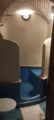 a bathroom with a tub and a toilet in a room at RIAD VERT de Nina in Marrakech