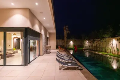 a swimming pool in a house at night at Villa Wimiliim - Piscine et jardin Privée Sans vis-à-vis Wifi HD in Segraga