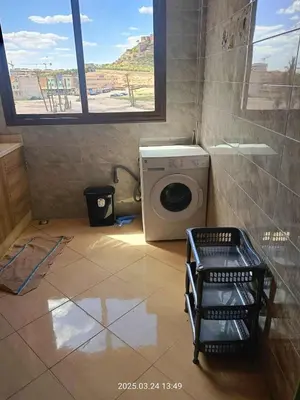 a washing machine in a bathroom with a window at Chicafrik in Marrakech