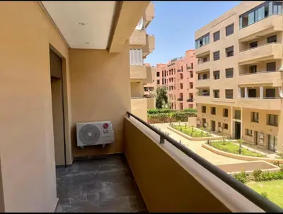 a room with a balcony with a speaker at Résidence palmeraie gates Marrakech in Marrakech