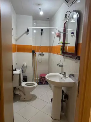 a bathroom with a toilet and a sink at 2BR w Balcony in Gueliz 2 Bedroom Apartment with Balcony in Gueliz in Marrakech