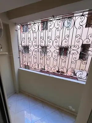 a iron gate in a room with a tile floor at 2BR w Balcony in Gueliz 2 Bedroom Apartment with Balcony in Gueliz in Marrakech