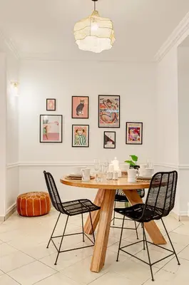 a dining room with a wooden table and chairs at NEW Cocon cosy au coeur de Marrakech in Marrakech