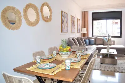 a living room with a table with fruit on it at Menara Palms Marrakech in Marrakech
