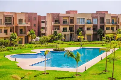 an image of an apartment complex with a swimming pool at Prestigia Apartment Secure Residence Pool in Marrakech