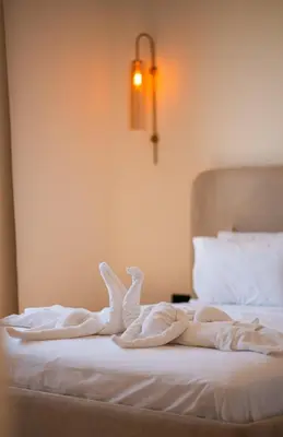 a bed with two swans made out of towels at Villa Assia Modern Luxury Private Pool in Marrakech