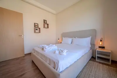 a bedroom with a bed with towels on it at Villa Assia Modern Luxury Private Pool in Marrakech