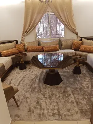 a living room with a couch and a table at Loger marrakech in Marrakech