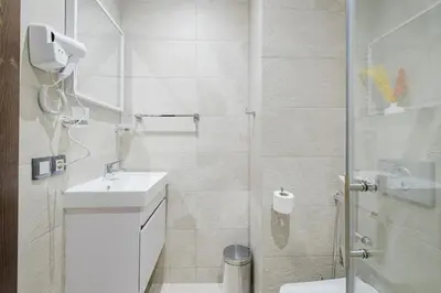 a bathroom with a shower and a toilet and a sink at 2BR NEW Luxury apartment CityCenter in Marrakech