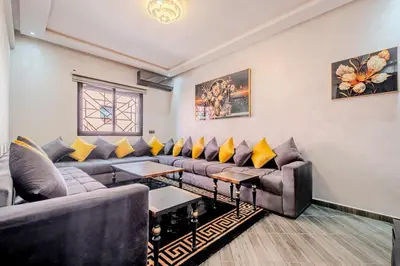 a living room with couches and yellow pillows at 5-min away to Marrakech Airport in Marrakech
