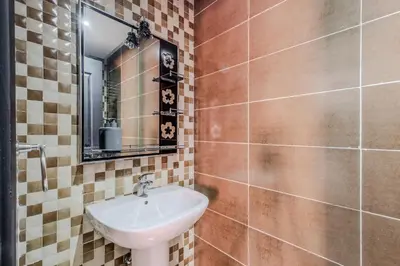 a bathroom with a sink and a mirror at 5-min away to Marrakech Airport in Marrakech