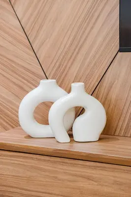 two white vases sitting on a wooden table at NEW - Central 1BR-Kingsize, AC & Terrace Parking in Marrakech