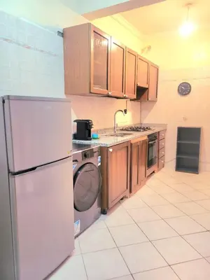 a kitchen with a white refrigerator and a dishwasher at Gueliz - Authentic 3 Majorelle central Marrakech in Marrakech