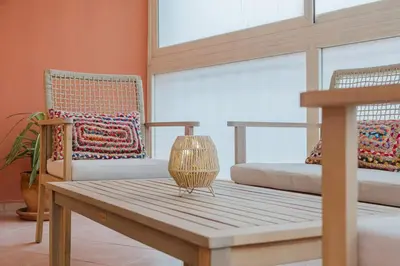 a room with a bench and a bed and a window at NEW 2Br Family-Friendly, in Center of Marrakech in Marrakech