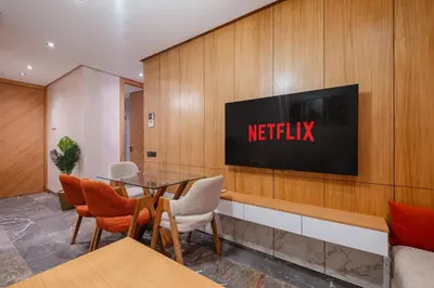 a meeting room with a television on a wall at New 2BR AC 5min from City Center-4 to 5Guests in Marrakech