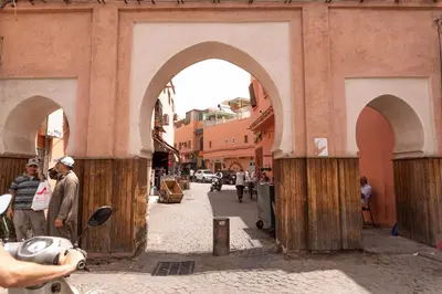 a group of people standing outside of a building at Authentic Moroccan Stay Steps from Jemaa el-Fna in Marrakech