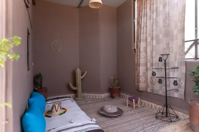 a bedroom with a cactus shower and a bed at Apartment with panoramic views of Koutoubia in Marrakech