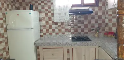 a kitchen with a refrigerator and a counter top at Chez Omar in Marrakech