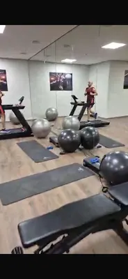 a group of people in a gym with pilates equipment at Le pavillon gueliz appartement de luxe in Marrakech