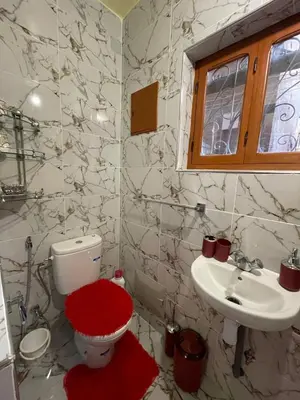 a bathroom with a toilet and a sink at chez Zaki in Marrakech