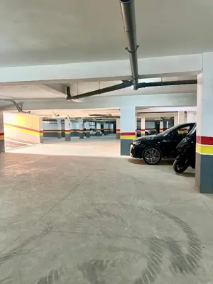 a parking garage with two cars parked in it at Studio prestige in Marrakech
