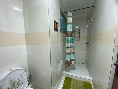 a bathroom with a shower and a toilet at Elégance marrakech in Marrakech