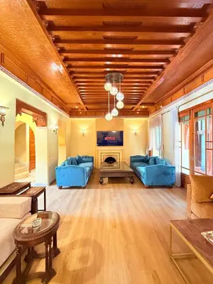 a living room with blue couches and a fireplace at VILLA 33 - 4 Master Suites, Stylish Moroccan Design & Private Pool in Marrakech