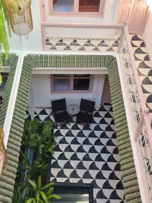 a porch with a black and white checkered floor at Riad Beltza - 