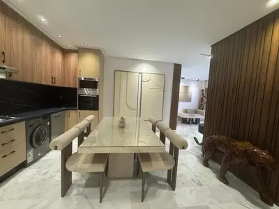 a dining room with a table and chairs in a kitchen at Elegant 2BDR Apartment with Pool in Gueliz in Marrakech