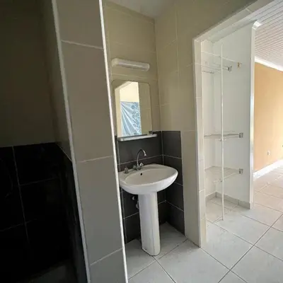a bathroom with a sink and a mirror at Dar lhssn in Marrakech