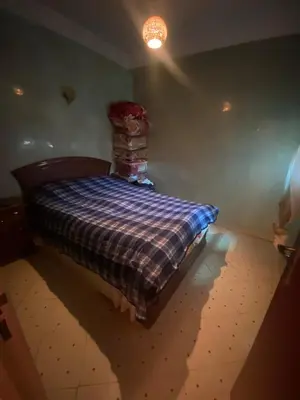 a bedroom with a bed in the corner of a room at Marrakech house Your Haven of Peace in Marrakech in Marrakech