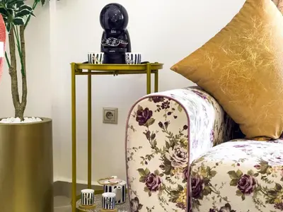 a camera sitting on a table next to a couch at Appartement privé au cœur de Marrakech in Marrakech