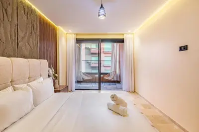 a living room with a couch and a teddy bear on the floor at Luxury 1BR in gueliz in Marrakech